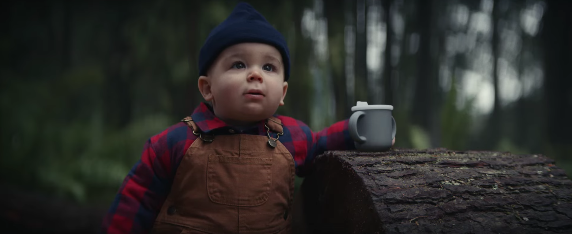 E trade baby in woods like a logger