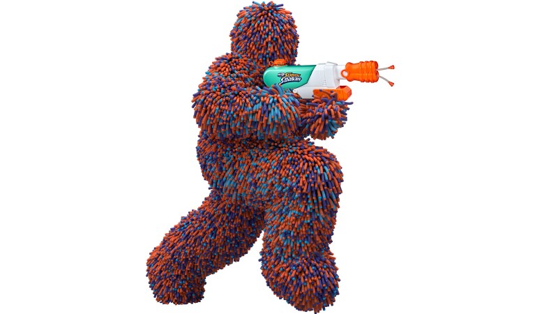 super soaker squirt gun held by Murph a mascot made of nerf bullets